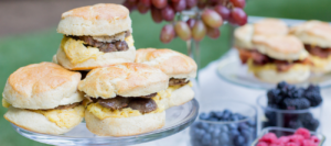 Assortment of freshly made breakfast sandwiches with eggs and meats, perfect for catering events, displayed at Mad Hatter Cafe & Bakeshop in Durham